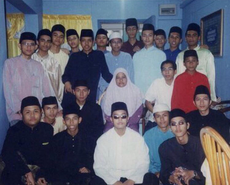 Madrasah Wak Tanjong Al Islamiah students including Ustaz Ahmad Faritz at a teacher's house