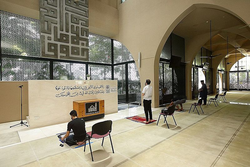 Essential workers pray at restricted spaces at mosques in Singapore